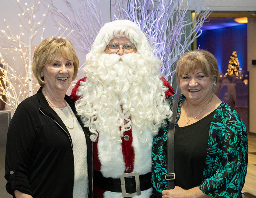 Employees with Santa at Employee Christmas Party